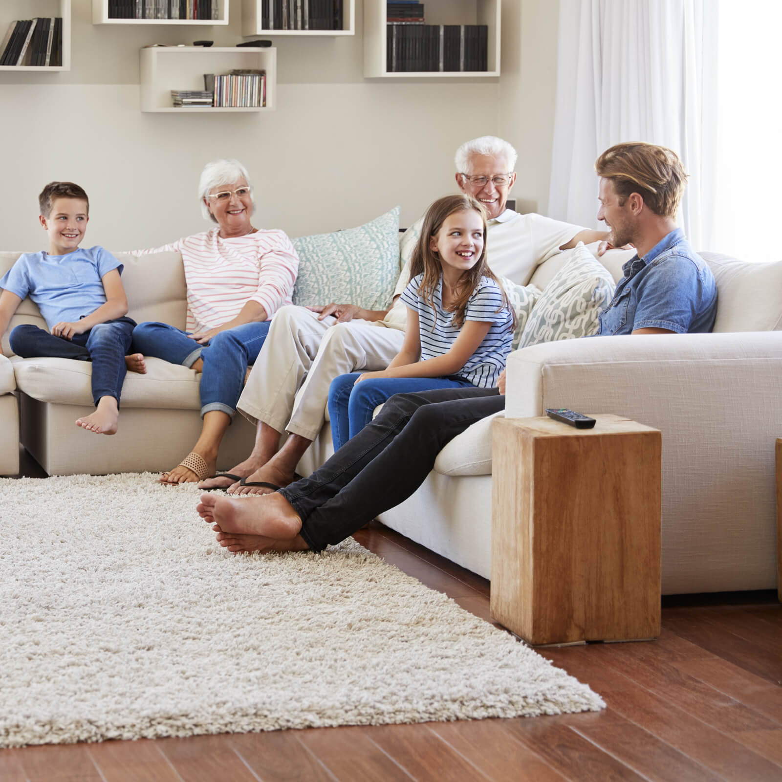 Family Talking Around Area Rug